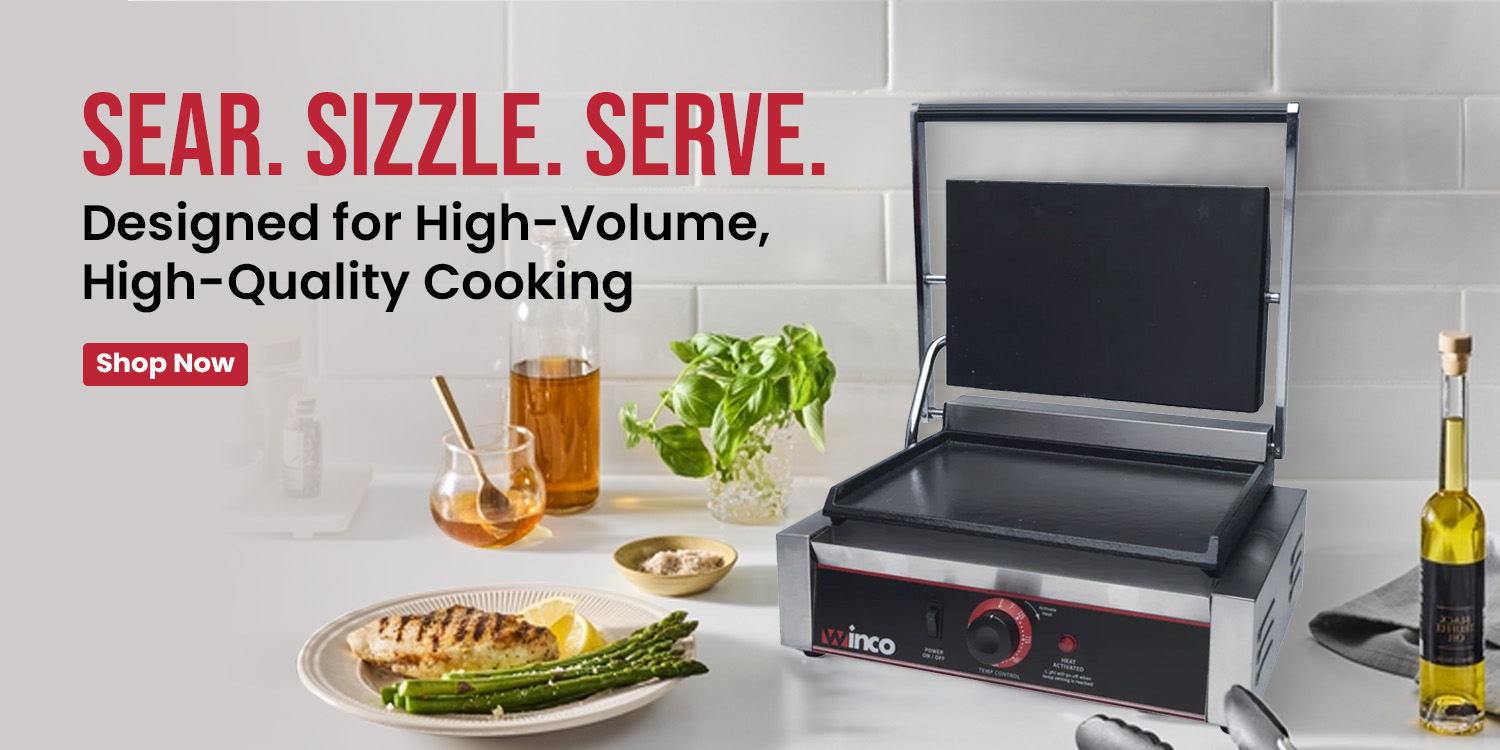Countertop grill press with open lid, surrounded by herbs, oil, and a plated meal, promoting high-volume professional cooking.